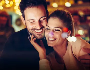 A smiling couple spending an evening together